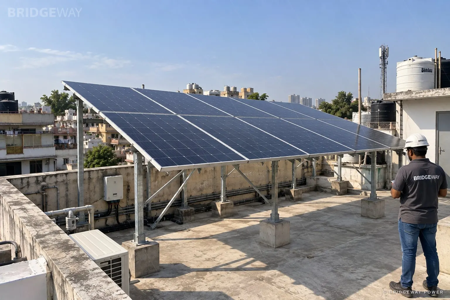DCR solar panels on an elevated structure at a Bridgeway rooftop solar installation in Delhi NCR